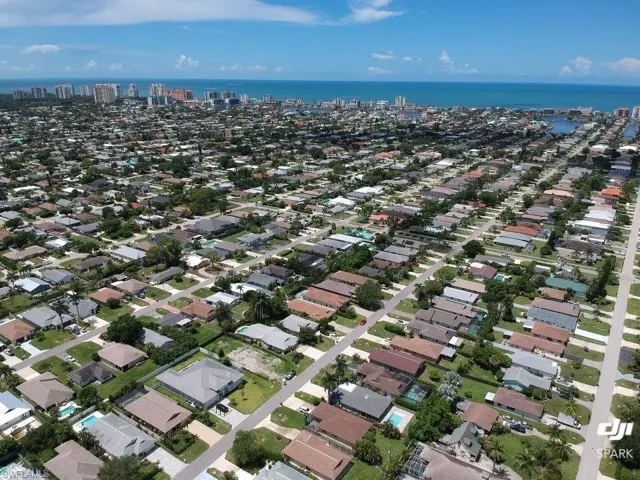 View of property location featuring a nearby body of water and nearby urban area