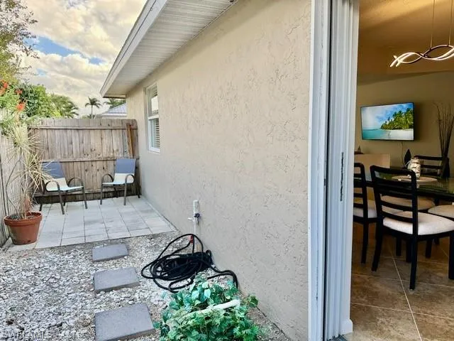 View of home's exterior featuring stucco siding and a patio