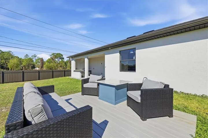 Wooden terrace with an outdoor hangout area