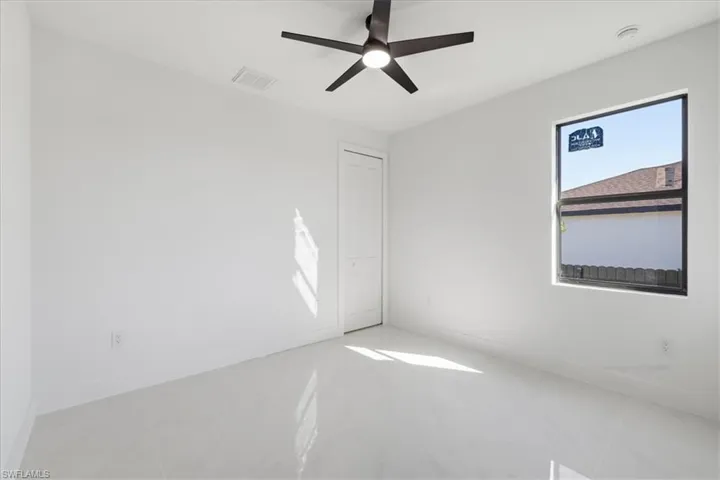 Unfurnished bedroom with ceiling fan