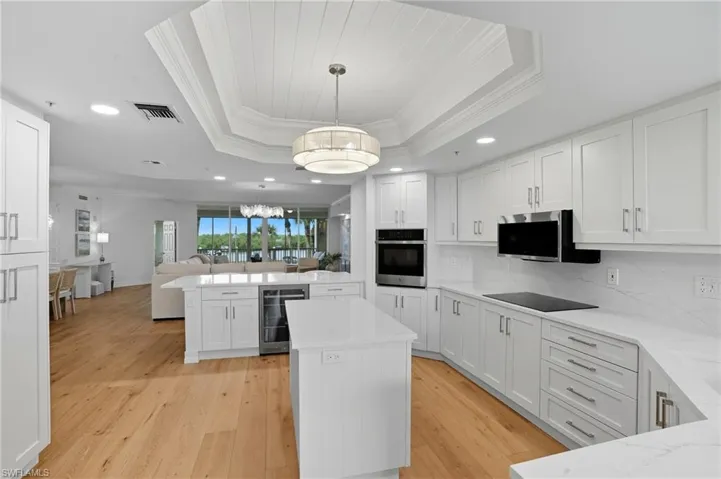 The Kitchen features White Shaker Cabinetry and Soft-Close Drawers.