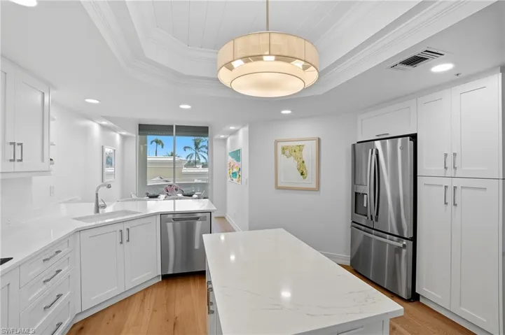 The Kitchen Features Ample Storage and Counter Space for Cooking.
