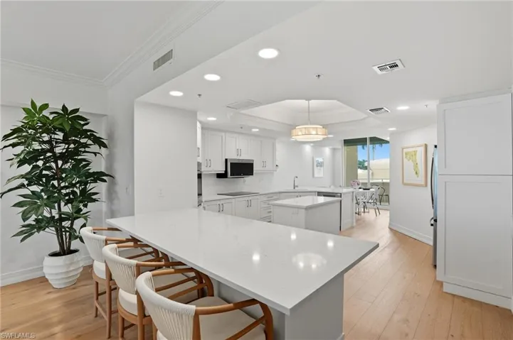 Reconfigured Kitchen - Now Featuring a Seamless Open Concept Layout with a Bar Area.