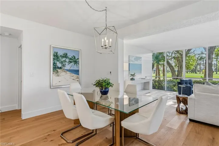 Dining room featuring light wood-style floors and a chandelier