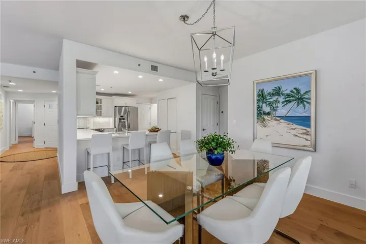 Dining space featuring recessed lighting, light wood-type flooring, and a chandelier