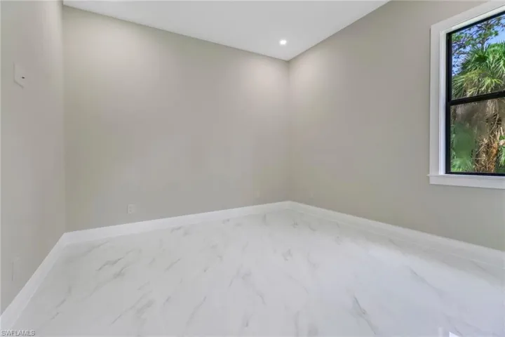 Spare room featuring a healthy amount of sunlight