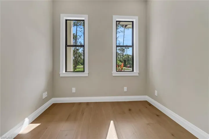 Unfurnished room featuring hardwood / wood-style flooring