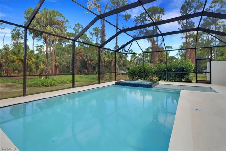 View of pool featuring a lanai