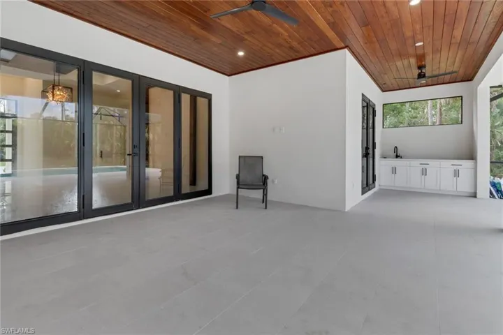 View of patio with french doors and ceiling fan