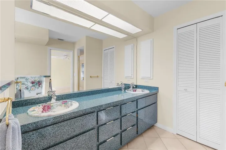 Bathroom with vanity and tile patterned floors