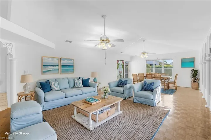 Living room featuring light parquet flooring