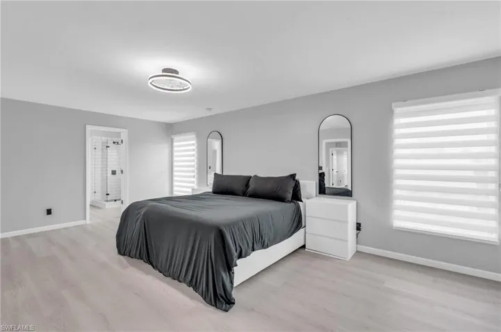 Bedroom with light hardwood / wood-style flooring