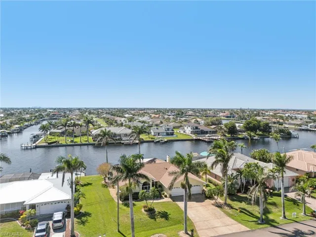 Bird's eye view with a water view and a residential view