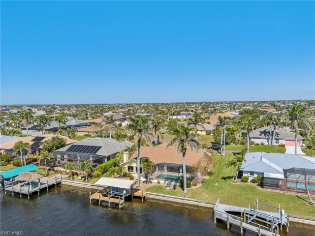 Drone / aerial view with a water view and a residential view