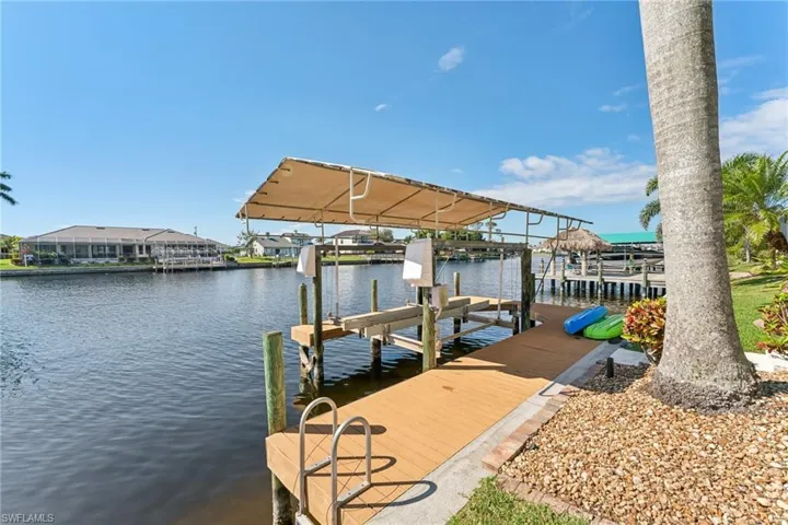 Dock area featuring a water view and boat lift