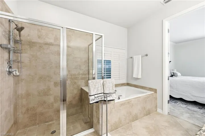 Master Bathroom with separate shower and bathtub