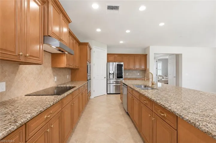 Open Kitchen layout with Island and Stainless Steel Appliances