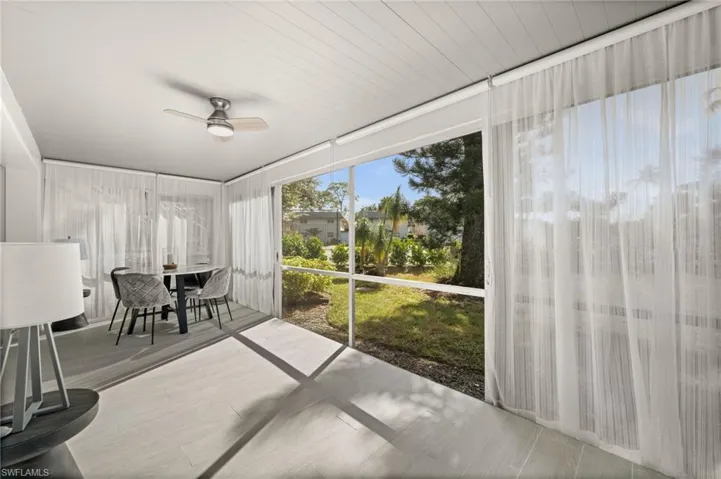 Sunroom / solarium with a ceiling fan