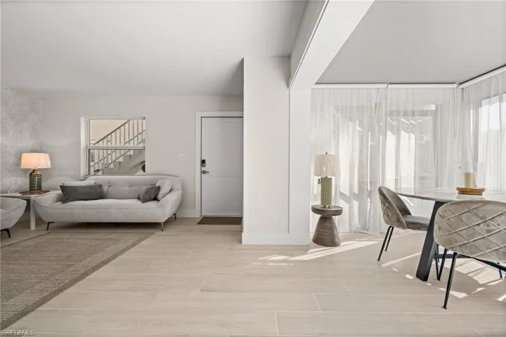 Dining room featuring wood finish floors and stairs