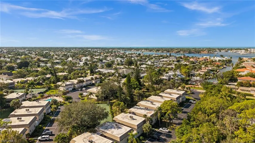 Aerial view of residential area featuring a large body of water
