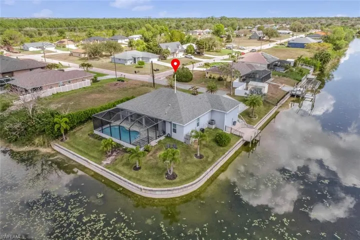 Aerial perspective of suburban area with a nearby body of water