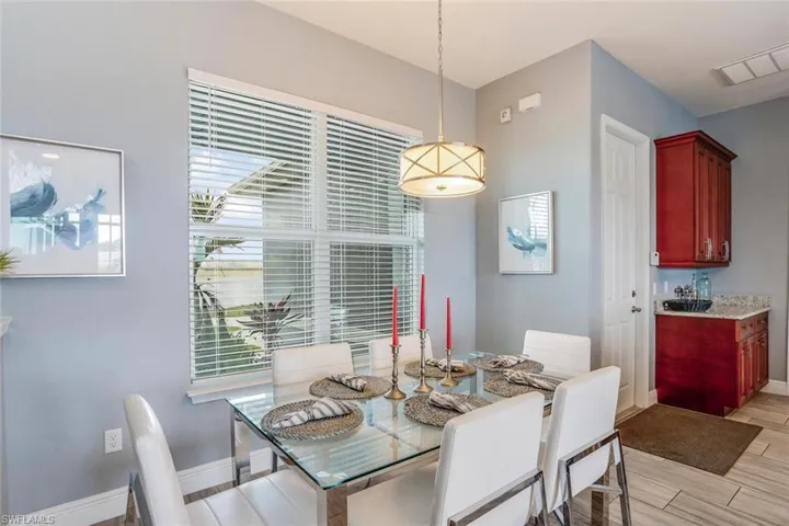 Dining room with wood tiled floors and baseboards