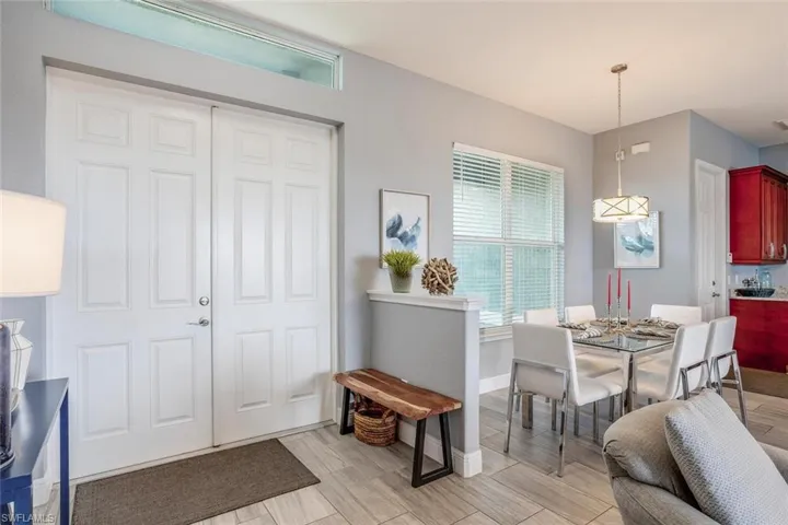 Dining area with healthy amount of natural light and wood finish floors