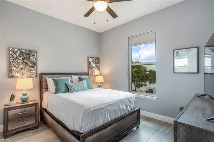 Bedroom with baseboards and a ceiling fan