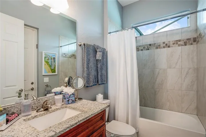 Full bath with vanity and shower / tub combo