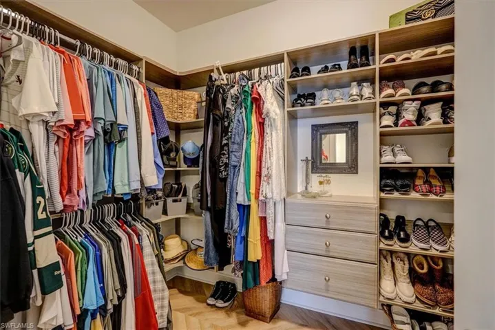 Spacious closet with wood finished floors
