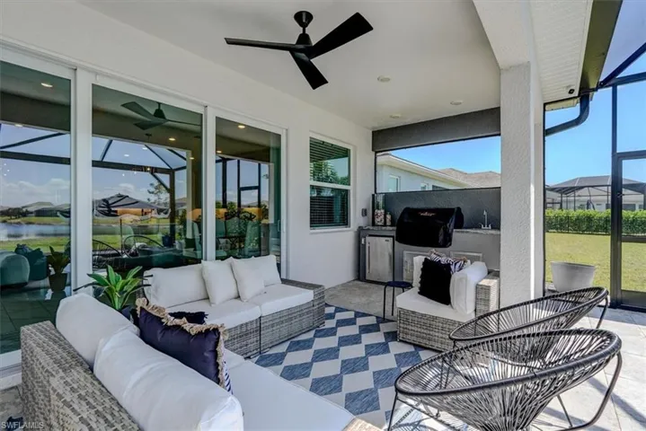 Sunroom / solarium with outdoor lounge area and a ceiling fan