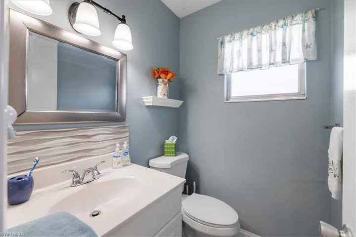 Bathroom featuring toilet and vanity
