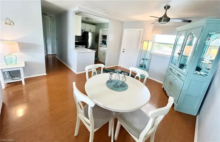 Dining room featuring light wood finished floors and a ceiling fan