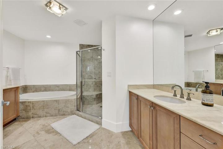 Large primary bathroom with dual vanities, large walk-in shower and soaking tub.