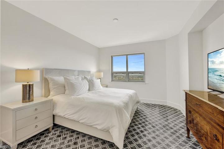 Guest bedroom with en suite bathroom. Custom luxury carpet adds a touch of sophistication to this room.