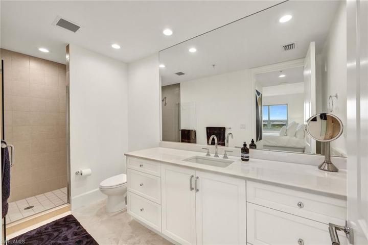 En suite guest bathroom with walk in shower & new "cloud white" vanity.