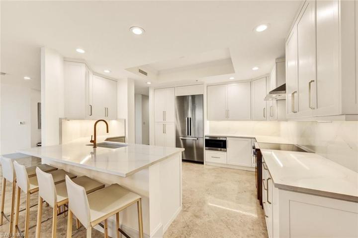 Pull out drawers, quartz countertops and a built in microwave are just a few of this kitchen's highlights.