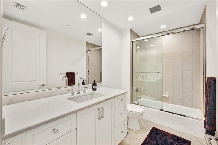 Third full bathroom, located off hallway leading to guest bedrooms. Tub/shower, new "cloud white" vanity and countertop.