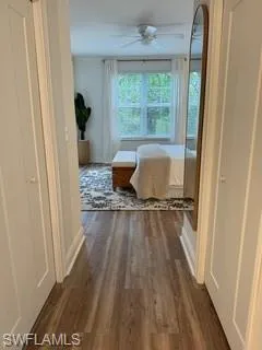 Corridor featuring dark hardwood / wood-style floors