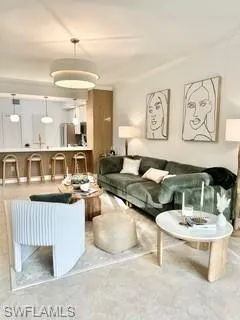 Living room featuring crown molding and tile patterned flooring