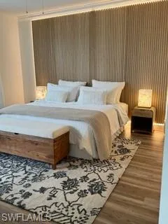 Bedroom featuring wood-type flooring