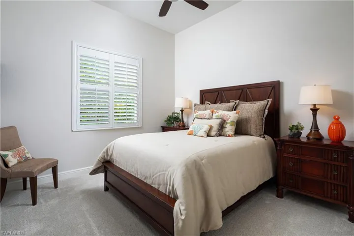 Carpeted bedroom with ceiling fan