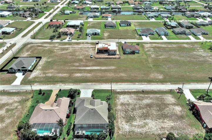 Aerial view of residential area with a nearby body of water