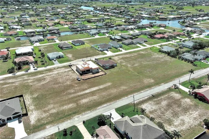 Aerial view of residential area with a large body of water