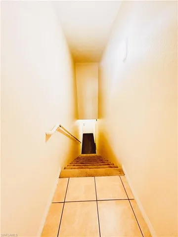 Staircase to both the front entry and the garage.