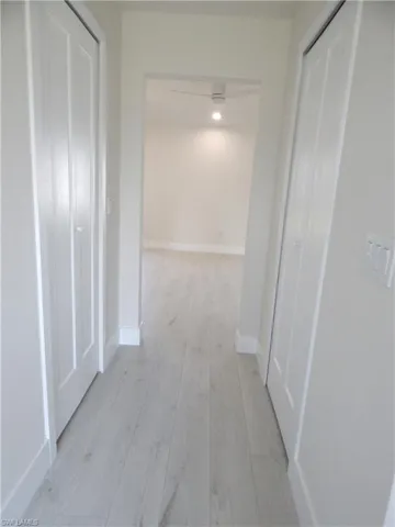 Hall to bathroom. Closets to both sides