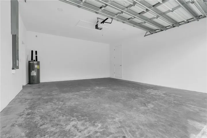 Garage with electric water heater and electric panel