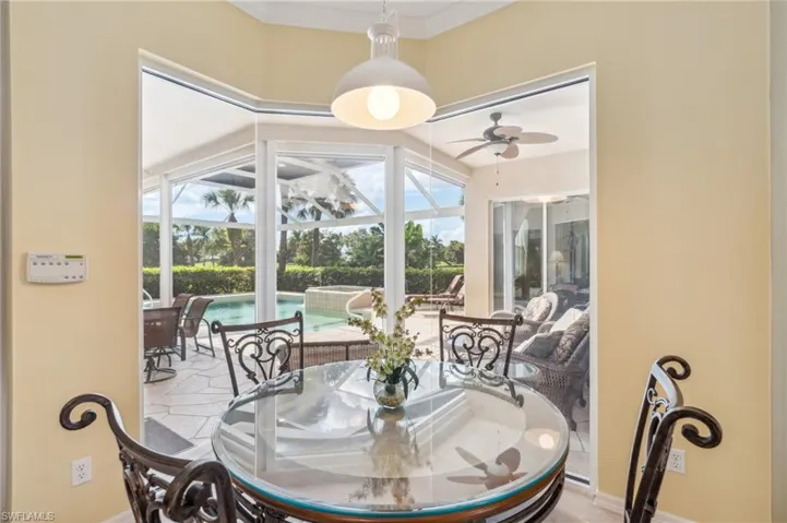 Dining area featuring ornamental molding and ceiling fan