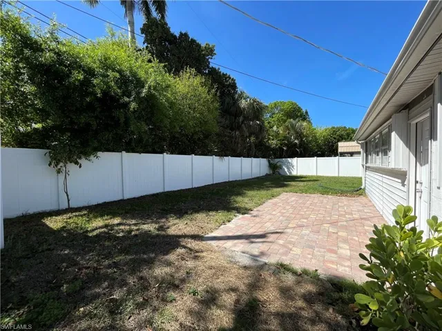 Fenced backyard featuring a patio