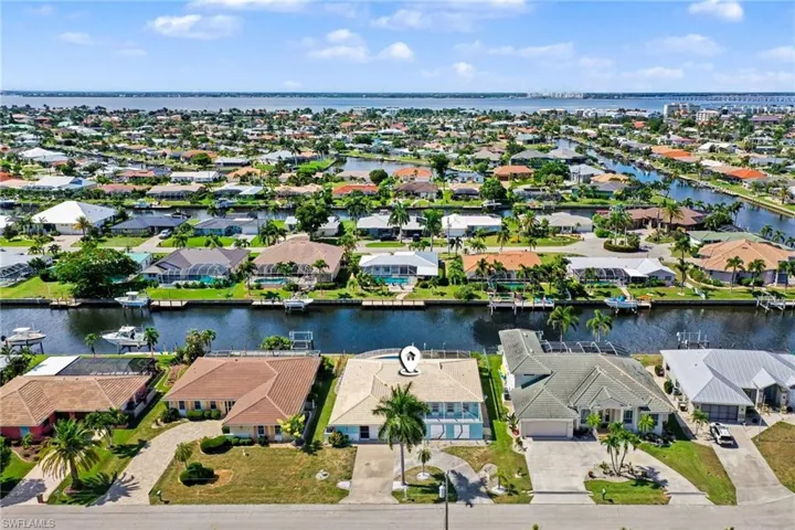 Welcome to 548 Belvedere Ct - your dream waterfront setting only 6-8 minutes to open water (looking north at canal system and view of Peace River meeting Charlotte Harbor)